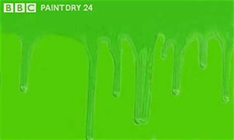 green paint dripping down a flat surface