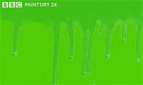 green paint dripping down a flat surface